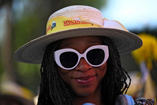 A woman takes part in a demonstration on the International Day for the Elimination of Violence against Women in Guatemala City, on November 25, 2025. (Photo by Johan ORDONEZ / AFP)