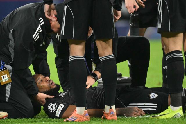 Garabagh's Colombian defender #81 Kevin Medina receives medical support after a clash during the UEFA Champions League - league phase day 5 football match between Napoli and Qarabag at the Diego Armando Maradona stadium in Naples on November 25, 2025. (Photo by Alberto PIZZOLI / AFP)