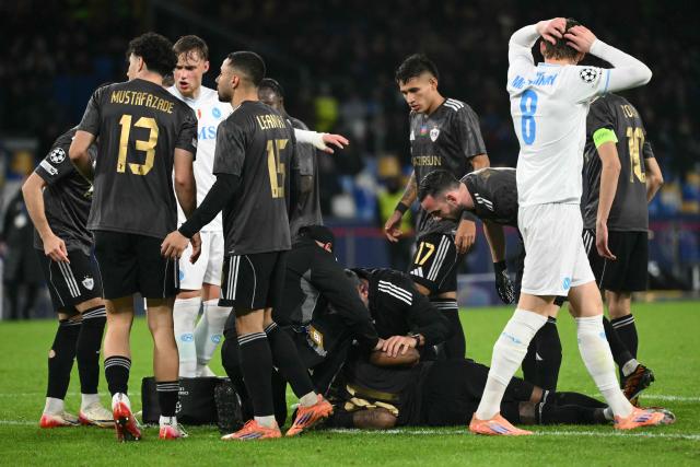 Garabagh's Colombian defender #81 Kevin Medina receives medical support after a clash during the UEFA Champions League - league phase day 5 football match between Napoli and Qarabag at the Diego Armando Maradona stadium in Naples on November 25, 2025. (Photo by Alberto PIZZOLI / AFP)