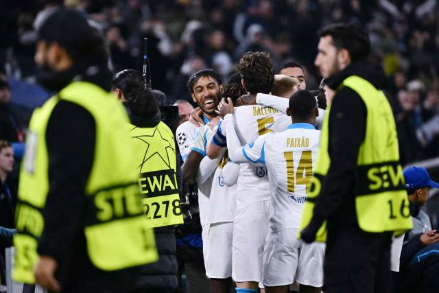 Marseille's Gabonese forward #97 Pierre-Emerick Aubameyang (C) celebrates with teammates  after scoring his team's first goal during the UEFA Champions League, league phase - matchday 5, football match between Olympique de Marseille (OM) and Newcastle United FC at the Velodrome Stadium in Marseille, southeastern France, on November 25, 2025. (Photo by Christophe SIMON / AFP)