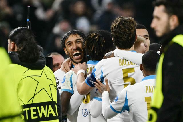 Marseille's Gabonese forward #97 Pierre-Emerick Aubameyang (C) celebrates with teammates  after scoring his team's first goal during the UEFA Champions League, league phase - matchday 5, football match between Olympique de Marseille (OM) and Newcastle United FC at the Velodrome Stadium in Marseille, southeastern France, on November 25, 2025. (Photo by Christophe SIMON / AFP)