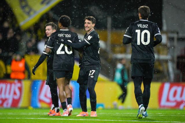 Juventus' Belgian forward #20 Lois Openda (L) celebrates with Juventus' Italian defender #27 Andrea Cambiaso celebrates after scoring the equalising goal during the UEFA Champions League football match between Bodoe/Glimt and Juventus Turin in Bodoe, on November 25, 2025. (Photo by Stian Lysberg Solum / NTB / AFP) / Norway OUT