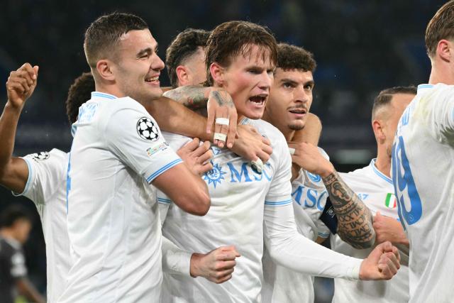 Napoli's Scottish midfielder #08 Scott McTominay (C) celebrates scoring his team's first goal during the UEFA Champions League - league phase day 5 football match between Napoli and Qarabag at the Diego Armando Maradona stadium in Naples on November 25, 2025. (Photo by Alberto PIZZOLI / AFP)