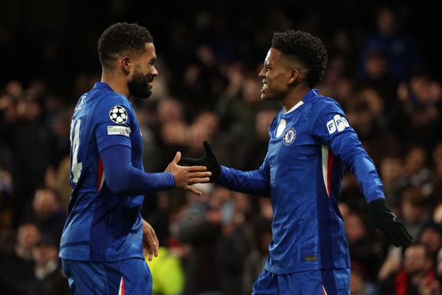 Chelsea's Brazilian midfielder #41 Estevao (R) celebrates with Chelsea's English defender #24 Reece James (L) after scoring their second goal during the UEFA Champions League league-phase football match between Chelsea and Barcelona at Stamford Bridge in London on November 25, 2025. (Photo by Adrian Dennis / AFP)