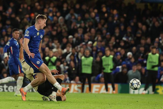 Chelsea's English striker #09 Liam Delap shoots to score their third goal during the UEFA Champions League league-phase football match between Chelsea and Barcelona at Stamford Bridge in London on November 25, 2025. (Photo by Adrian Dennis / AFP)