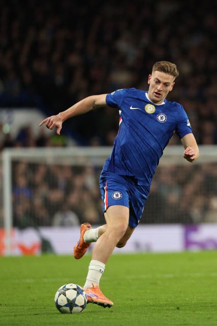 Chelsea's English striker #09 Liam Delap runs with the ball during the UEFA Champions League league-phase football match between Chelsea and Barcelona at Stamford Bridge in London on November 25, 2025. (Photo by Adrian Dennis / AFP)