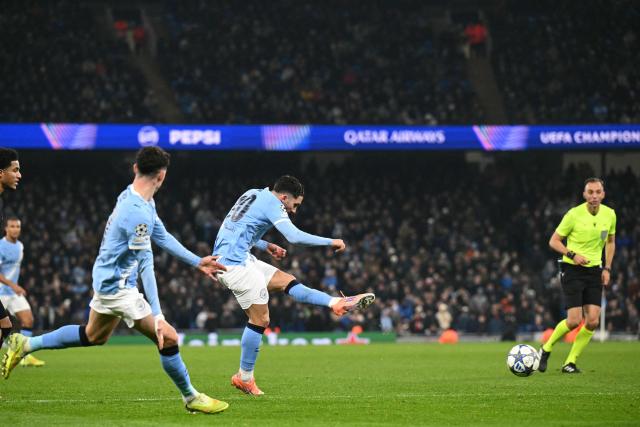 Manchester City's French midfielder #10 Rayan Cherki shoots but fails to score during the UEFA Champions League league-stage football match between Manchester City and Bayer Leverkusen at the Etihad Stadium in Manchester, north west England, on November 25, 2025. (Photo by Oli SCARFF / AFP)