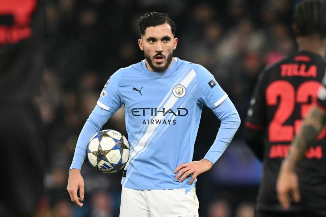 Manchester City's French midfielder #10 Rayan Cherki prepares to take a freekick during the UEFA Champions League league-stage football match between Manchester City and Bayer Leverkusen at the Etihad Stadium in Manchester, north west England, on November 25, 2025. (Photo by Oli SCARFF / AFP)