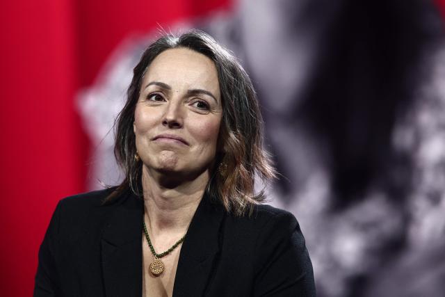 Widow of Eric Comyn, Harmonie Coumyn, looks on during "Face a vous - Les grands enjeux de demain" (Face to face with you - The major challenges of tomorrow) debate show hosted by French weekly newspaper Le Journal du Dimanche (JDD) at the Le Dome de Paris - Palais des Sports in Paris on November 25, 2025. (Photo by Thibaud MORITZ / AFP)