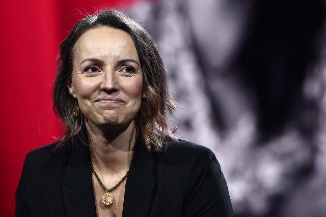Widow of Eric Comyn, Harmonie Coumyn, reacts during "Face a vous - Les grands enjeux de demain" (Face to face with you - The major challenges of tomorrow) debate show hosted by French weekly newspaper Le Journal du Dimanche (JDD) at the Le Dome de Paris - Palais des Sports in Paris on November 25, 2025. (Photo by Thibaud MORITZ / AFP)