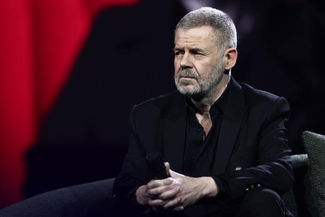 French literary critic Eric Naulleau looks on during "Face a vous - Les grands enjeux de demain" (Face to face with you - The major challenges of tomorrow) debate show hosted by French weekly newspaper Le Journal du Dimanche (JDD) at the Le Dome de Paris - Palais des Sports in Paris on November 25, 2025. (Photo by Thibaud MORITZ / AFP)