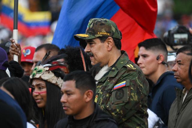 Venezuela’s President Nicolas Maduro (C) arrives at a military ceremony in Fuerte Tiuna, Caracas, on November 25, 2025. (Photo by Federico PARRA / AFP)