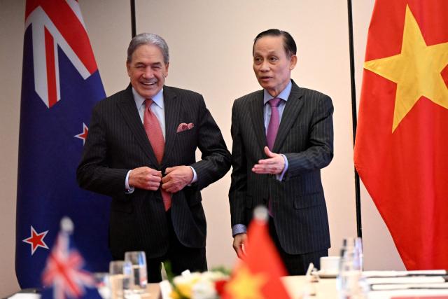 New Zealand's Foreign Minister Winston Peters (L) meets with Vietnam's Foreign Minister Le Hoai Trung (R) in Hanoi on November 26, 2025. (Photo by Nhac NGUYEN / AFP)