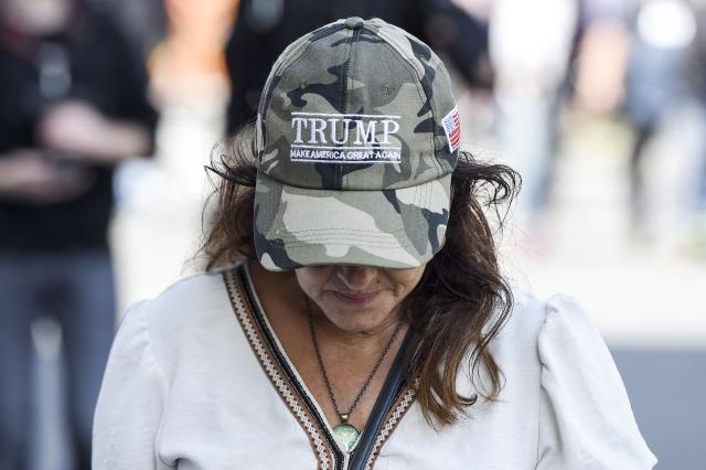 (FILES) A demonstrator protest with a cap reading "Trump, make America great again", during a national day of protest against the compulsory Covid-19 vaccination for certain workers and the mandatory use of the health pass called for by the French government in Nantes, western France on August 7, 2021. With Donald Trump’s return to power, the American radical right has launched an ideological offensive beyond its borders—particularly in France, where authorities are closely monitoring the influence of this nebulous movement as key elections approach. (Photo by Sebastien SALOM-GOMIS / AFP)
