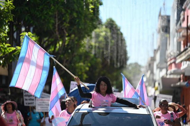 Transgender women take part in a demonstration on the International Day for the Elimination of Violence against Women, in Guatemala City on November 25, 2025. (Photo by Johan ORDÓÑEZ / AFP)