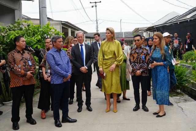 Queen Maxima of the Netherlands (C), in her capacity as the UN Secretary General's Special Advocate for Financial Health (UNSGSA), visits a subsidised housing complex for low-income families in Bekasi, West Java, on November 26, 2025. (Photo by Tatan Syuflana / POOL / AFP)