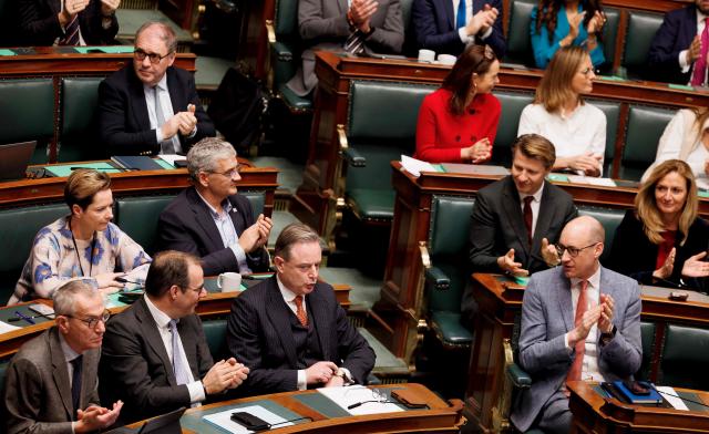 Belgium's Prime Minister Bart De Wever (3rd L) attends a plenary session during the Prime Minister's political declaration at Belgium's federal parliament, in Brussels on November 26, 2025. (Photo by BENOIT DOPPAGNE / Belga / AFP) / Belgium OUT