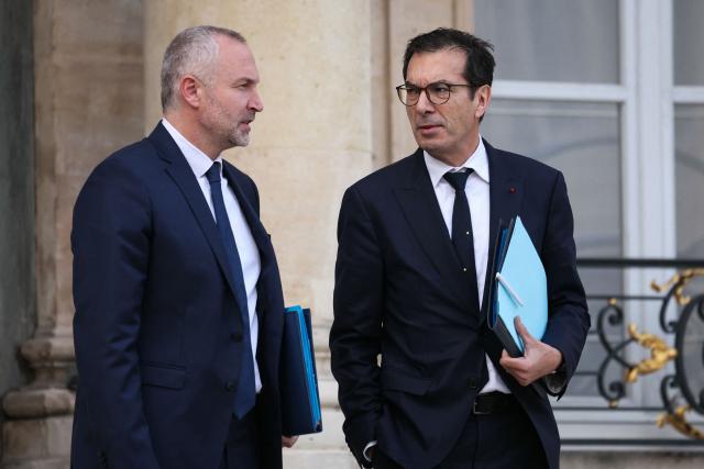 France's Labour Minister Jean-Pierre Farandou (R) and France's junior Minister in charge of parliament relations Laurent Panifous leave the Elysee Palace, in Paris after the weekly cabinet meeting, on November 26, 2025. (Photo by Thomas SAMSON / AFP)