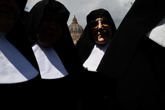 TOPSHOT - AFP PICTURES OF THE YEAR 2025

Nuns walk on St Peter's Square, near front of St Peter's Basilica (seen rear), in The Vatican, on May 7, 2025. (Photo by JEFF PACHOUD / AFP) / AFP PICTURES OF THE YEAR 2025