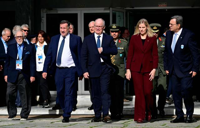 Executive Board and the IOC President Kirsty Coventry in the flame lighting ceremony of the Olympic flame, for the Olympic Winter Games Milano Cortina 2026, at the Museum of ancient Olympia, in Olympia on November 26, 2025. (Photo by Aggelos NAKKAS / AFP)
