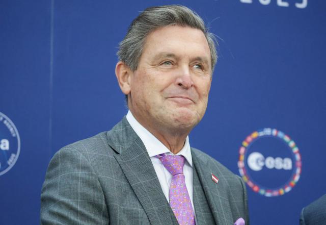 Peter Hanke, Austrian Federal Minister of Innovation, Mobility and Infrastructure, poses for a photo prior to the start of the European Space Agency (ESA) ministerial meeting at the Congress Centrum in Bremen, northern Germany, on November 26, 2025. Ministers from the 23 member states of the European Space Agency (ESA) meet in the Hanseatic city for two days to discuss the strategic direction of European spaceflight. (Photo by FOCKE STRANGMANN / AFP)