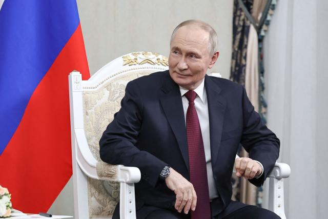 In this pool photograph distributed by the Russian state agency Sputnik, Russia's President Vladimir Putin attends a meeting with Belarus' President in Bishkek on November 26, 2025, on the eve of a meeting of the Collective Security Treaty Organisation (CSTO) Heads of State Council. (Photo by Alexander KAZAKOV / POOL / AFP)