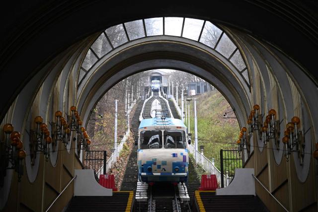 A funicular carriage departs from a station in Kyiv on November 26, 2025, amid the Russian invasion of Ukraine.  (Photo by Sergei GAPON / AFP)