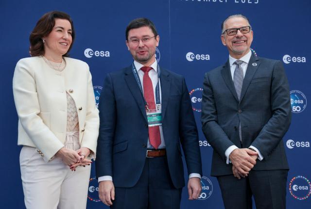 (From L) German Minister for Research, Technology and Aerospace Dorothee Baer, Czech Director of ITS and Space Activities, Research, Development and Innovations to the Ministry of Transport Vaclav Kobera and ERSA General Director Josef Aschbacher pose for the medias during the European Space Agency (ESA) ministerial meeting at the Congress Centrum in Bremen, northern Germany, on November 26, 2025. Ministers from the 23 member states of the European Space Agency (ESA) meet in the Hanseatic city for two days to discuss the strategic direction of European spaceflight. (Photo by FOCKE STRANGMANN / AFP)