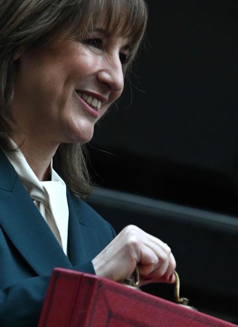 Britain's Chancellor of the Exchequer Rachel Reeves poses with the red Budget Box as she leaves 11 Downing Street, in central London, on November 26, 2025, to present the government's annual Budget to Parliament. (Photo by JUSTIN TALLIS / AFP)