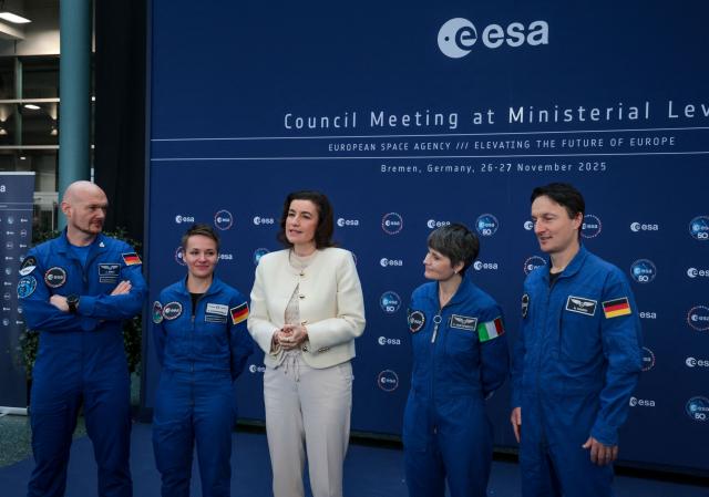 German Minister for Research, Technology and Aerospace Dorothee Baer (C) gives a press statement flanked with astronauts (From L) Alexander Gerst, Amelie Schoenenwald, Samantha Cristoforetti and Matthias Maurer during the European Space Agency (ESA) ministerial meeting at the Congress Centrum in Bremen, northern Germany, on November 26, 2025. Ministers from the 23 member states of the European Space Agency (ESA) meet in the Hanseatic city for two days to discuss the strategic direction of European spaceflight. (Photo by FOCKE STRANGMANN / AFP)