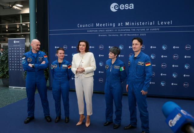 German Minister for Research, Technology and Aerospace Dorothee Baer (C) gives a press statement flanked with astronauts (From L) Alexander Gerst, Amelie Schoenenwald, Samantha Cristoforetti and Matthias Maurer during the European Space Agency (ESA) ministerial meeting at the Congress Centrum in Bremen, northern Germany, on November 26, 2025. Ministers from the 23 member states of the European Space Agency (ESA) meet in the Hanseatic city for two days to discuss the strategic direction of European spaceflight. (Photo by FOCKE STRANGMANN / AFP)