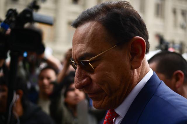 Peru's former president (2018-2020) Martin Vizcarra arrives at the Carlos Zavala Loayza Judiciary Building in Lima on November 26, 2025, ahead of the verdict in his corruption trial. (Photo by ERNESTO BENAVIDES / AFP)