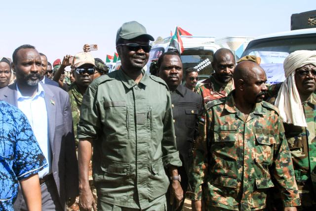 Darfur Regional Governor and leader of the Sudan Liberation Movement (SLM), Minni Arko Minnawi, arrives at the Al-Afad camp for displaced people in the town of Al-Dabba, northern Sudan, on November 26, 2025. Since its outbreak in April 2023, the war between Sudan's army and the paramilitary Rapid Support Forces (RSF) has killed tens of thousands of people and displaced nearly 12 million. At the end of October, the paramilitary group seized control El-Fasher, the conclusion of a bitter 18-month siege for the strategic hub in western Sudan's Darfur region and marked by reports of mass killings and sexual violence. (Photo by Ebrahim Hamid / AFP)