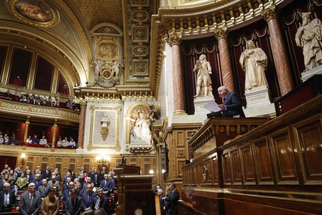 Senate president Gerard Larcher (R) calls for a minute of silence in memory of several senators who have recently passed away during a session of questions to the government at the Senate, the French Parliament upper house, in Paris on November 26, 2025. (Photo by GEOFFROY VAN DER HASSELT / AFP)