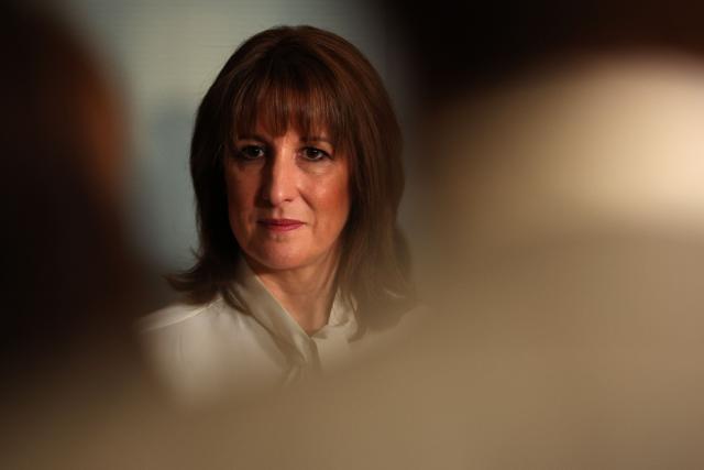 Britain's Chancellor of the Exchequer Rachel Reeves takes a question from a journalist after speaking to nurses and members of the media during a visit to University College London Hospital in London, on November 26, 2025. (Photo by Adrian Dennis / POOL / AFP)