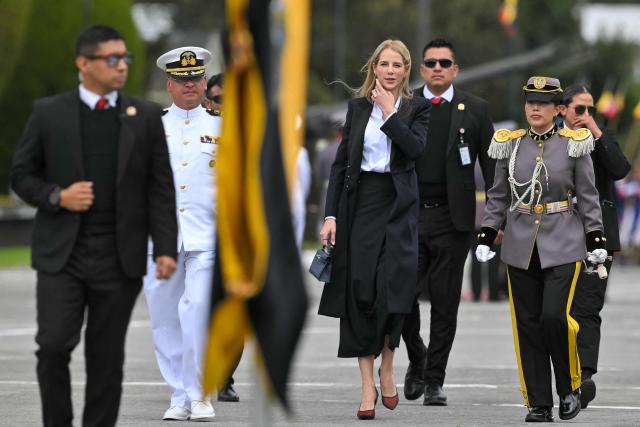 Ecuador's First Lady Lavinia Valbonesi (C) attends the change of command ceremony for the Joint Command of the Armed Forces at the Eloy Alfaro Superior Military School on the outskirts of Quito on November 26, 2025. (Photo by Rodrigo BUENDIA / AFP)