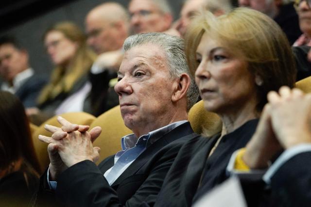 Former Colombian president and 2016 Nobel Peace Prize laureate Juan Manuel Santos (L) and his wife Clemencia Rodriguez attend the commemoration of nine years of the peace agreement at Cinemateca in Bogota on November 26, 2025. (Photo by Sergio Yate / AFP)