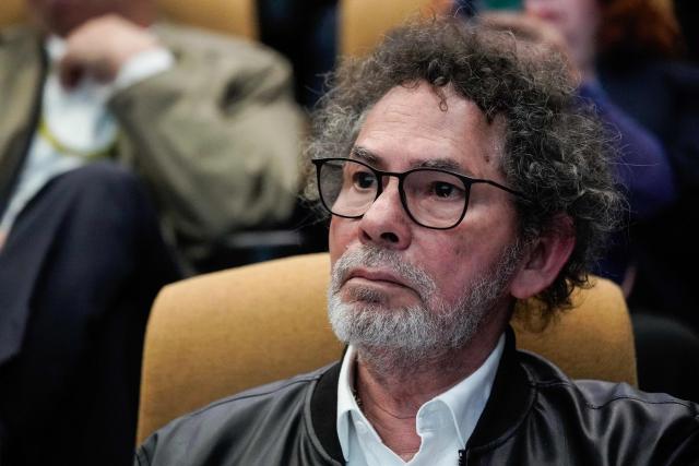 Former FARC commander Pastor Alape attends the commemoration of nine years of the peace agreement at Cinemateca in Bogota on November 26, 2025. (Photo by Sergio Yate / AFP)