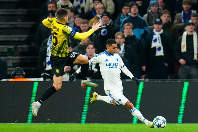 FC Copenhagen's Peruvian defender #15 Marcos Lopez (R) and Kairat Almaty's Belarus midfielder #55 Valeri Gromyko vie for the ball during the UEFA Champions League league phase day 5 football match between FC Copenhagen and FC Kairat Almaty in Copenhagen, Denmark, on November 26, 2025. (Photo by Ida Marie Odgaard / Ritzau Scanpix / AFP) / Denmark OUT