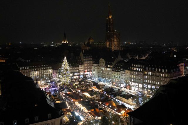 This photograph shows an overview of the Christmas market at the Place Kleber with the Cathedral in the background in Strasbourg, eastern France, on November 26, 2025. (Photo by ROMEO BOETZLE / AFP)