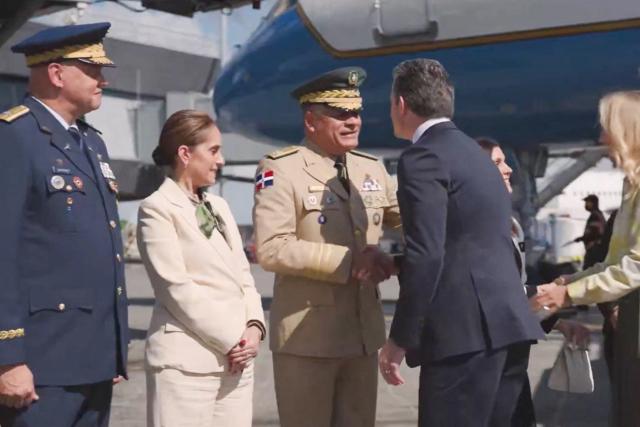 This screengrab of video footage taken and released by the US Department of Defense on November 26, 2025, shows the Secretary of Defense Pete Hegseth (R) shaking hands with Dominican Republic's Defense Minister Lt. Gen. Carlos Fernandez Onofre upon his arrival to Santo Domingo, Dominican Republic. Hegseth will meet with Dominican Republic President Luis Abinader and other officials "to strengthen defense relationships and reaffirm America's commitment to defend the homeland, protect our regional partners and ensure stability and security across the Americas", according to an official press release. (Photo by HANDOUT / US Department of Defense / AFP)