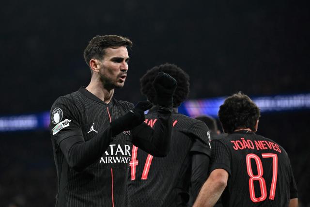 Paris Saint-Germain's Spanish midfielder #08 Fabian Ruiz (L) celebrates after scoring his team's third goal  during the UEFA Champions League, league phase - matchday 5, football match between Paris Saint-Germain (PSG) and Tottenham Hotspur FC at the Parc des Princes stadium in Paris on November 26, 2025. (Photo by JULIEN DE ROSA / AFP)