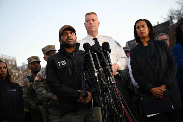 FBI Director Kash Patel (L), accompanied by DC Mayor Muriel Bowser (R) and Metropolitan Police Department Executive Assistant Chief Jeffery Carrroll speaks during a press conference after a shooting in downtown Washington, on November 26, 2025. On November 26, Police in Washington said they had detained a suspect after two National Guard troops were shot blocks away from the White House. Patel said the two Guard troops are in critical condition. (Photo by Drew ANGERER / AFP)