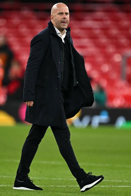 Liverpool's Dutch manager Arne Slot reacts after the UEFA Champions League league phase football match between Liverpool and PSV Eindhoven at Anfield in Liverpool, north west England on November 26, 2025. Arsenal won the match 3-1. (Photo by Paul ELLIS / AFP)