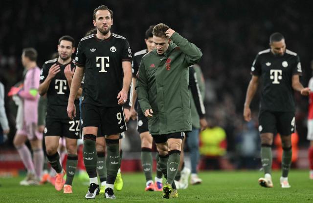 Bayern Munich's English forward #09 Harry Kane (2L) reacts after the UEFA Champions League league phase football match between Arsenal and Bayern Munich at the Emirates Stadium in north London on November 26, 2025. Arsenal won the match 3-1. (Photo by Ben STANSALL / AFP)