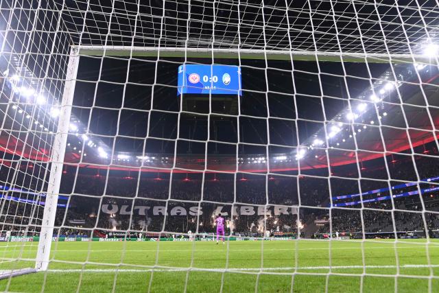 A banner on the terraces reads 'Ultras free' (Ultras liberi) during the UEFA Champions League league phase day 5 football match between Eintracht Frankfurt and Atalanta Bergamo in Frankfurt, Germany, on November 26, 2025. (Photo by Kirill KUDRYAVTSEV / AFP)
