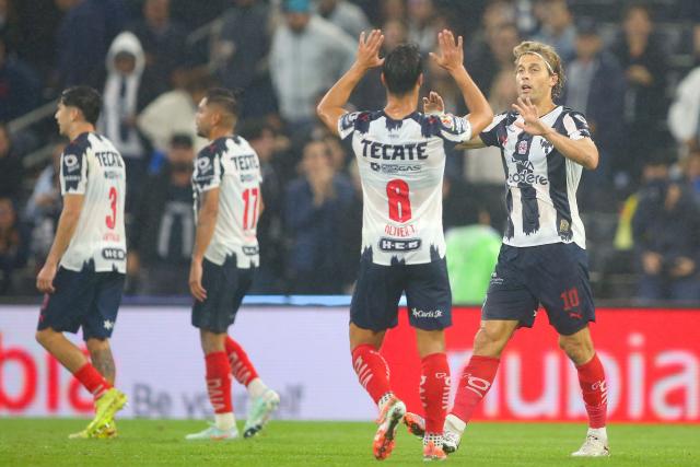 Monterrey's Spanish midfielder #10 Sergio Canales (R) celebrates with teammate Spanish midfielder #08 Oliver Torres (2nd-R) after scoring his team's first goal during the Liga MX Apertura quarter-final first leg football match between Monterrey and America at the BBVA Stadium in Monterrey, Nuevo Leon state, Mexico, on November 26, 2025. (Photo by Julio Cesar AGUILAR / AFP)