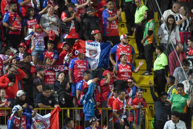 Xelaju's fans cheer for their team during the CONCACAF Central American Cup final first leg football match between Guatemala's Xelaju and Costa Rica's Alajuelense at the Alejandro Morera Soto Stadium in Alajuela, Costa Rica, on November 26, 2025. (Photo by Ezequiel BECERRA / AFP)