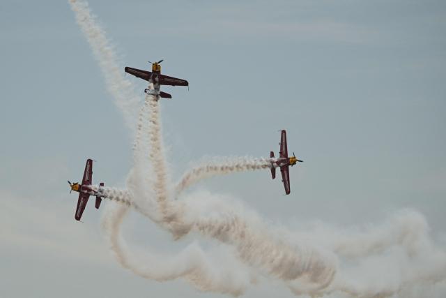 The Marksmen aerobatic team from South Africa performs during the Aero Asia 2025 in Zhuhai, in southern China's Guangdong province on November 27, 2025. Aero Asia 2025 is an international aviation and aerospace exhibition that runs between November 27 and 30. (Photo by Hector RETAMAL / AFP)