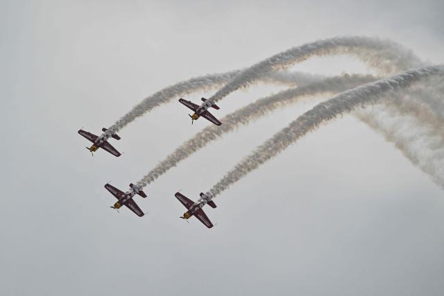 The Marksmen aerobatic team from South Africa performs during the Aero Asia 2025 in Zhuhai, in southern China's Guangdong province on November 27, 2025. Aero Asia 2025 is an international aviation and aerospace exhibition that runs between November 27 and 30. (Photo by Hector RETAMAL / AFP)